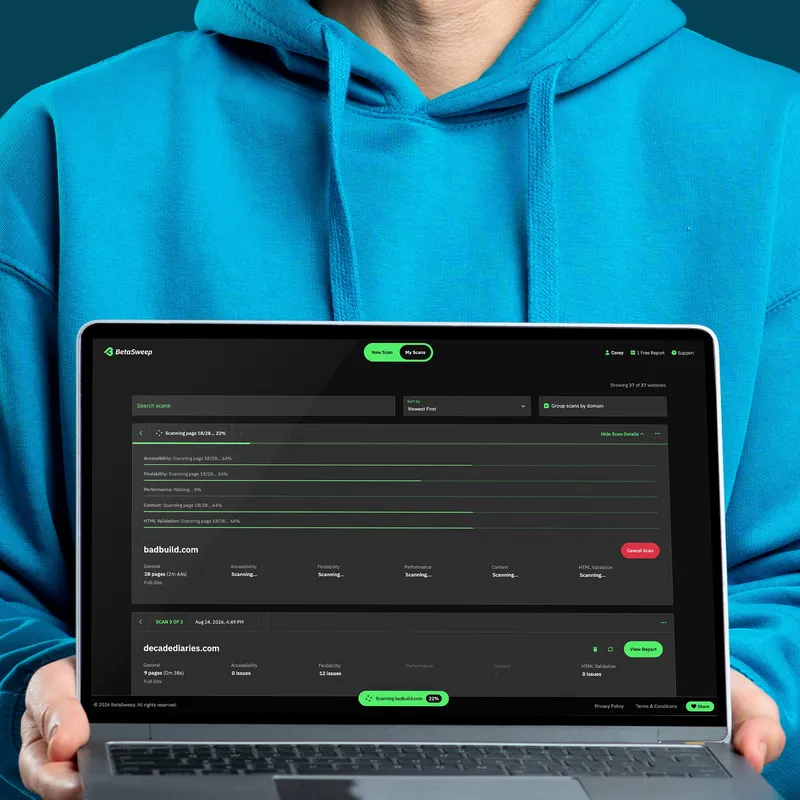 A young man holding a laptop showing the BetaSweep app running an active scan