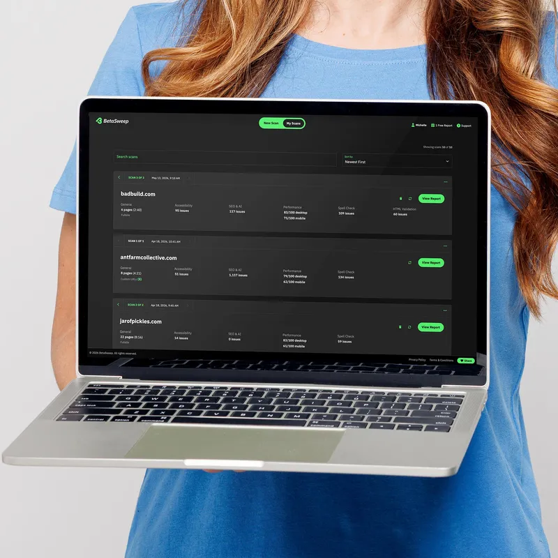 A young woman in a t-shirt holding a laptop showing a list of BetaSweep scans
