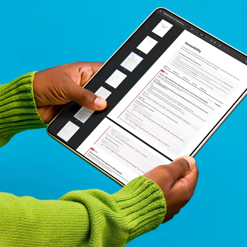 A woman holding a laptop showing the opening screen of the BetaSweep app